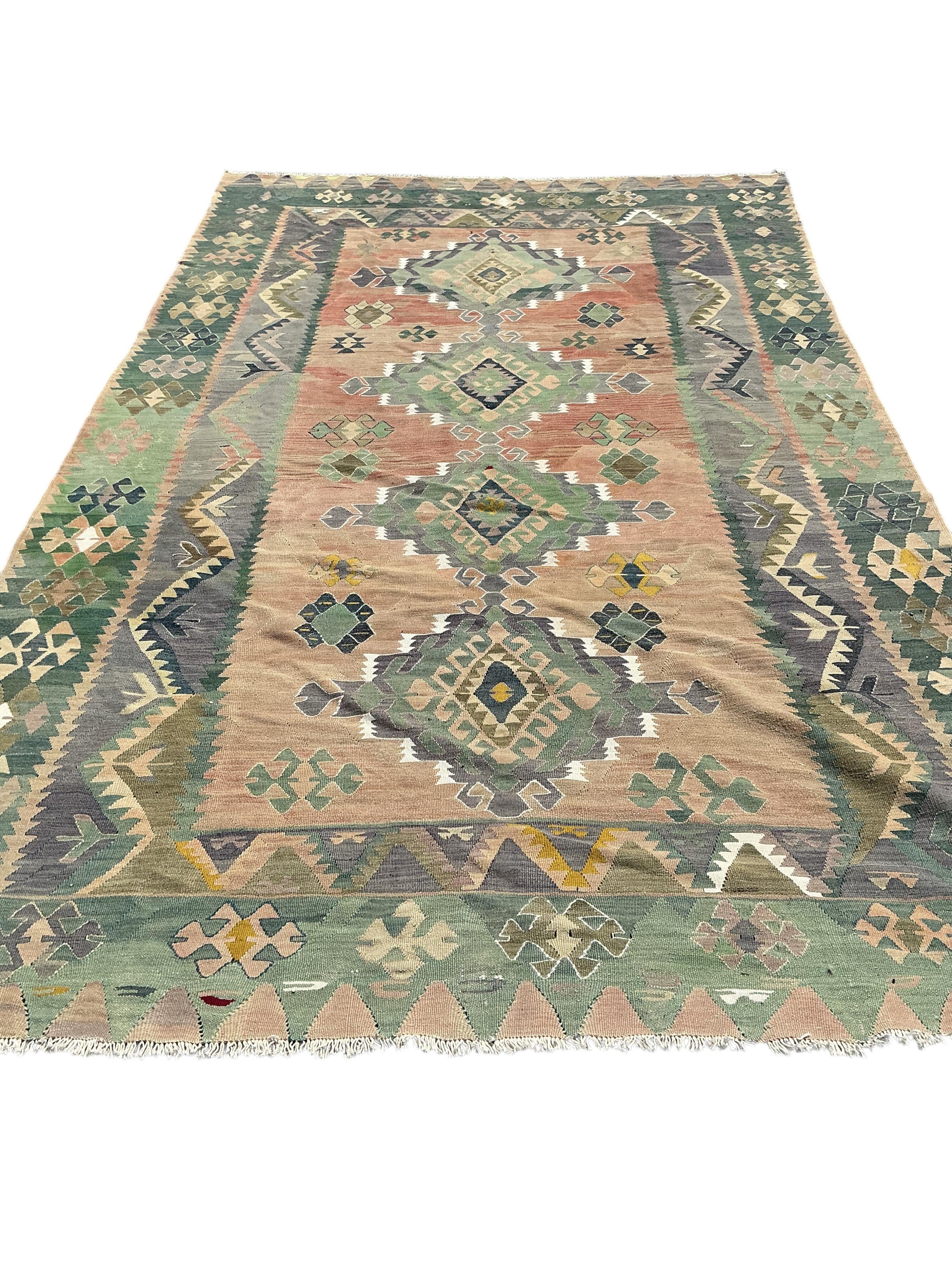 A Kelim polychrome medallion carpet, approximately 380 x 210cm
